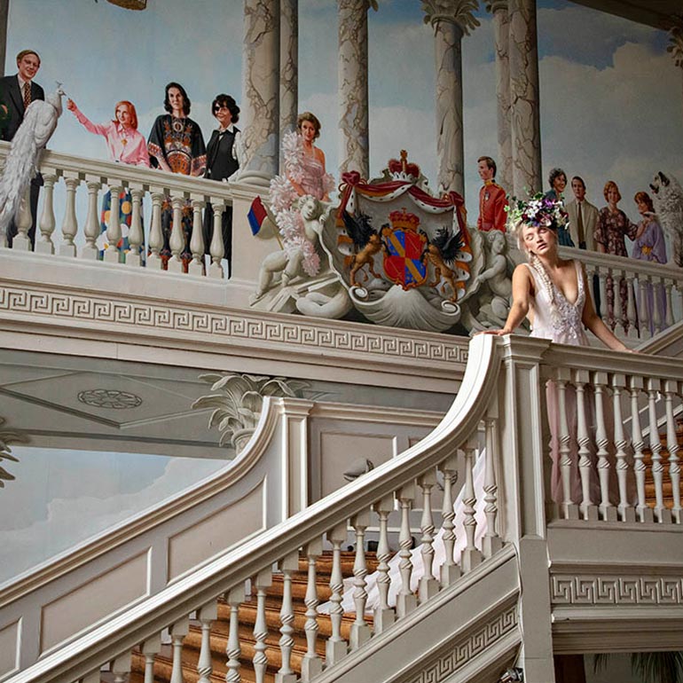Bride on staircase at Ragley Hall