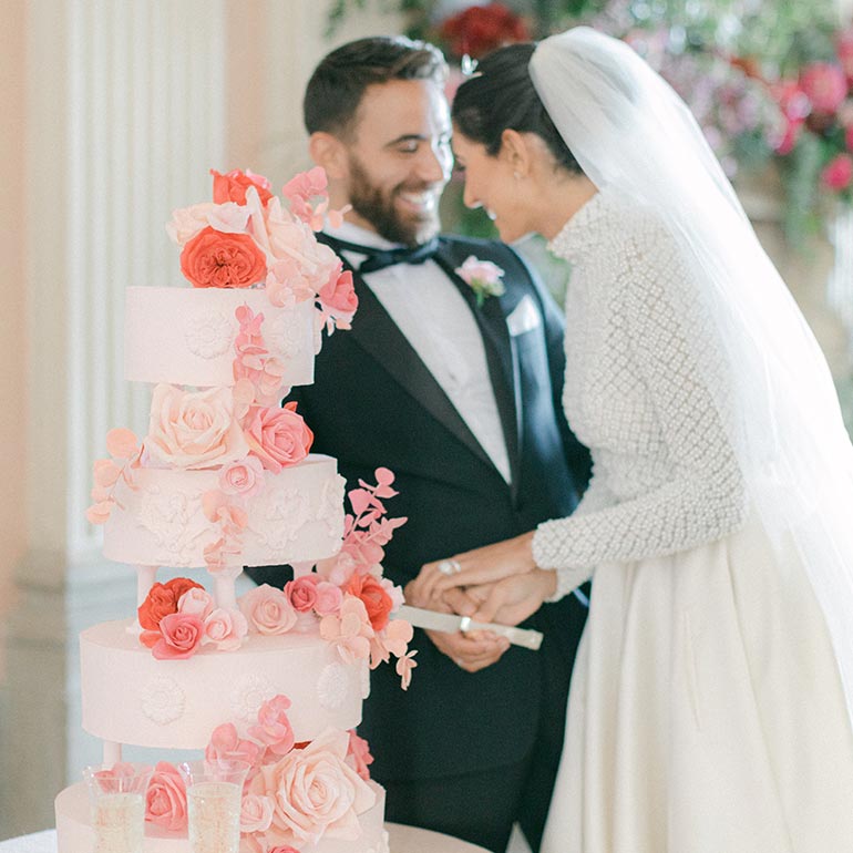 Wedding couple cutting wedding cake at Ragley Hall