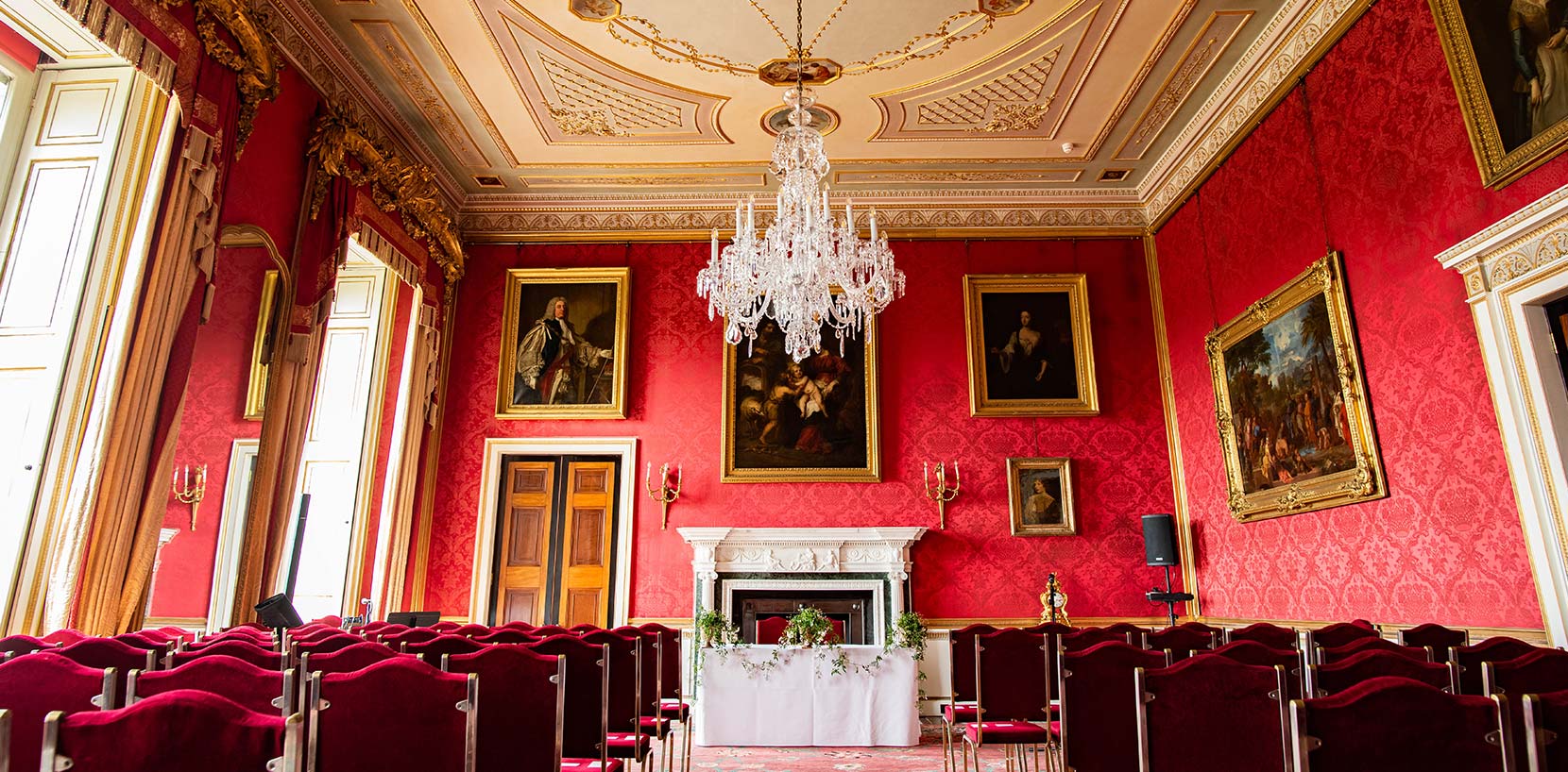 Red room at Ragley dressed for wedding ceremony