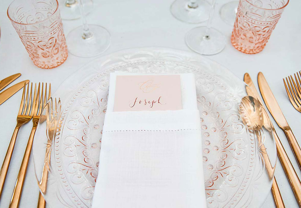 Wedding place setting with gold cutlery