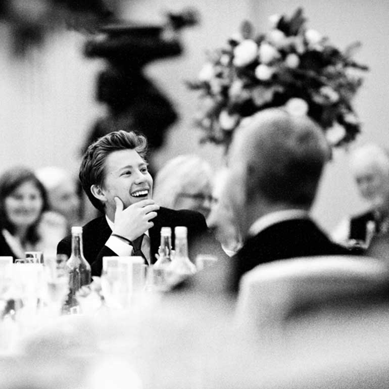 Laughing groom at wedding