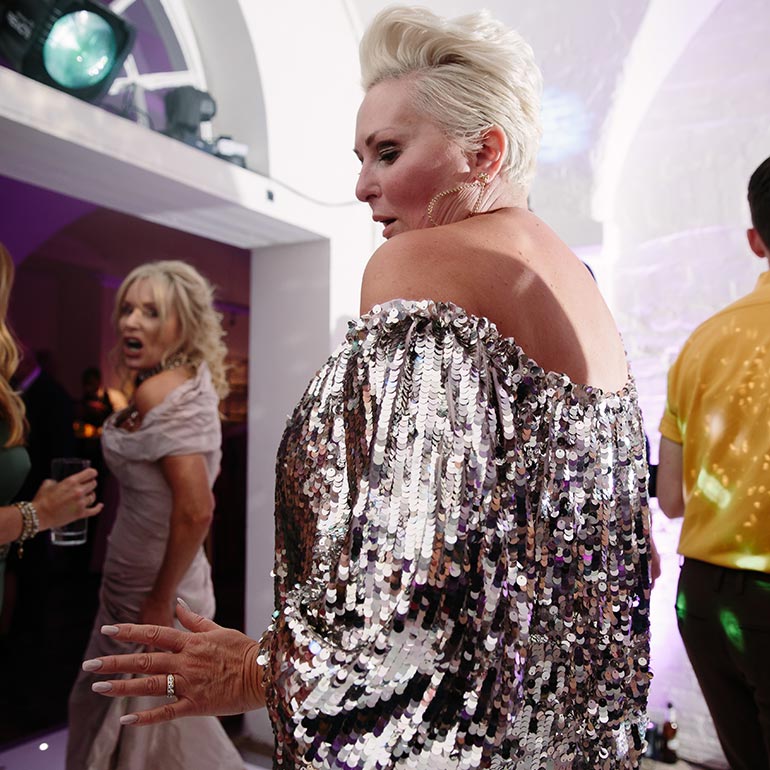 Woman in silver dress dancing